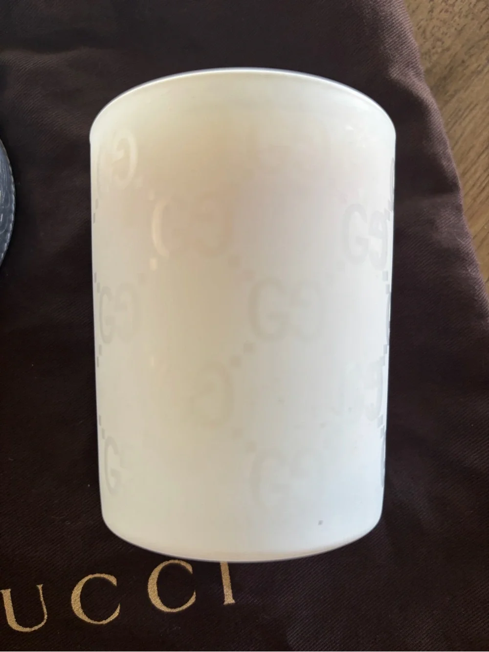 Gucci Candle Holder with lid and glass container with candle.